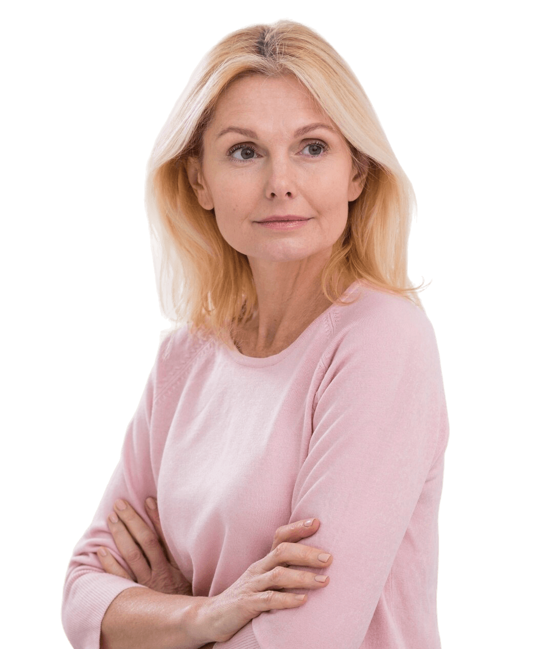 Confident middle-aged woman with blonde hair standing with folded arms, representing healthy aging, hormone balance, wellness, and vitality